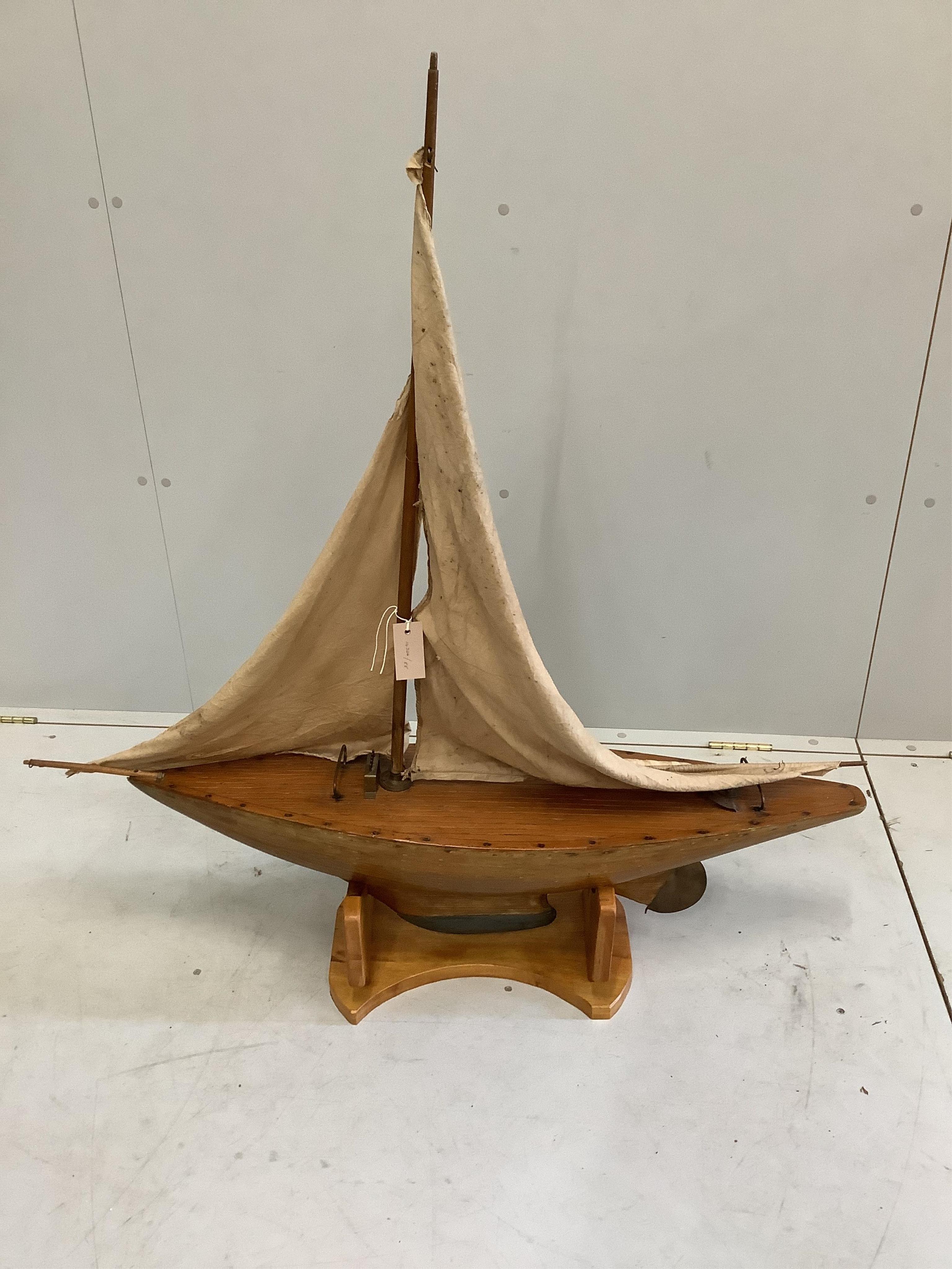 An early 20th century pond yacht on later stand, length 108cm, height including stand 112cm